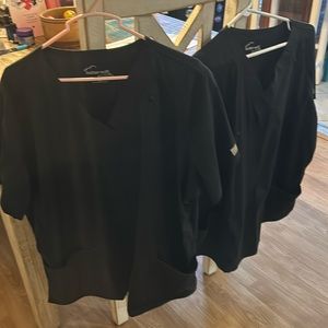 Scrub tops cost is for a set of two black scrub tops. Butter-Soft.